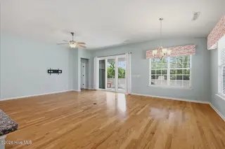 212 Cable Lake Circle, Calabash, NC 28467 – photo 13: Dining area into living room