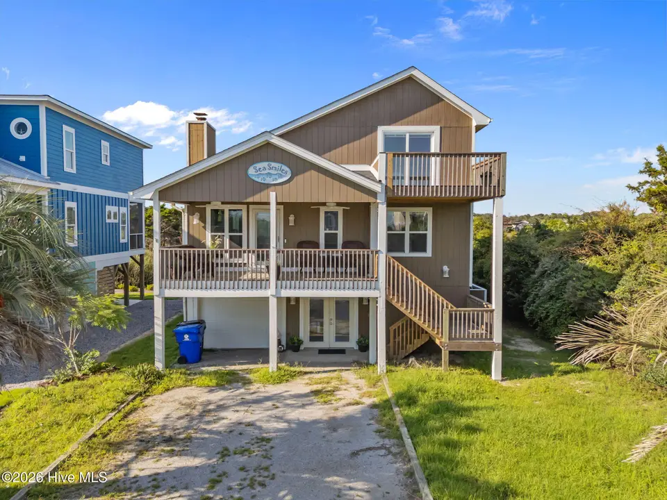 312 E Dolphin Drive, Oak Island, NC 28465 – photo 1 of 61: 1-web-or-mls-DJI_20250826170800_0118_D