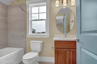 468 Summerhouse Drive, Holly Ridge, NC 28445 – photo 23: Tile and tub upstairs