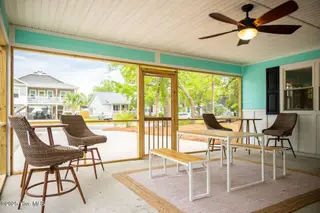 221 NE 58th Street, Oak Island, NC 28465 – photo 15: SCREENED IN PATIO
