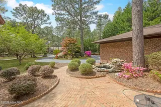 111 Somerset Lane, Seven Lakes, NC 27376 – photo 4: front7 patio-water feature