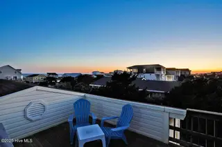 2021 W Dolphin Drive, Oak Island, NC 28465 – photo 7: 2021WestBeachDrivetwilight-3