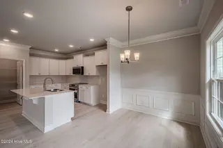 1025 Wood Creek Road NE, Leland, NC 28451 – photo 14: *REPRESENTATIVE PHOTO*Kitchen and Dining