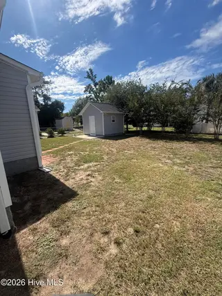 115 NW 17th Street, Oak Island, NC 28465 — 2-bedroom home in Pinners Point, Oak Island, NC, photo 6 of 7: Rear Yard