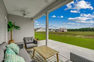 494 Goldenrod Terrace Lot 53, Calabash, NC 28467 – photo 6: Covered-Porch-2---Gwinnett