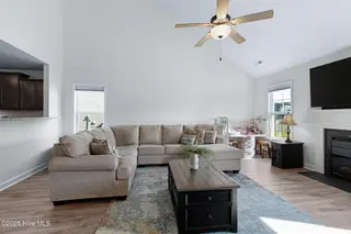 107 Peletier Shores Drive, Peletier, NC 28584 – photo 12: Living room with electric fireplace