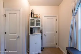 464 Water Wagon Trail, Jacksonville, NC 28546 – photo 24: Pantry and Laundry Room Door