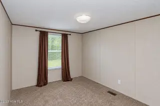 102 Bonnie Farms Road, Dudley, NC 28333 — 3-bedroom manufactured home in Bonnie Farms, Dudley, NC, photo 19 of 20: bed2