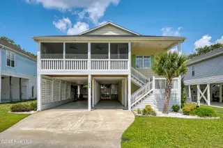 409 Womble Street, Oak Island, NC 28465 – photo 2: Ample Parking Covered and Driveway