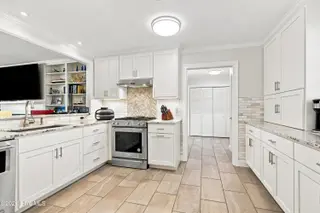 104 Sea Trace Lane, Newport, NC 28570 – photo 19: Kitchen opening to Garage & Laundry