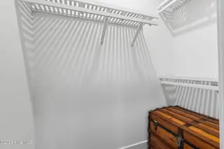 135 NW 7th Street, Oak Island, NC 28465 – photo 20: Bedroom 1 closet