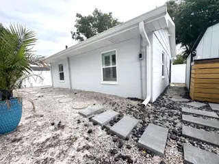 113 NW 12th Street, Oak Island, NC 28465 – photo 21: Backyard with Beautiful Stepping Stones