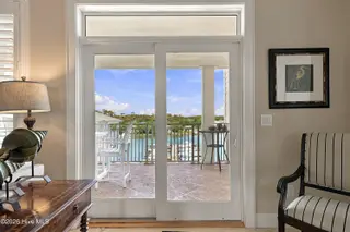 150 Lands End Court A42, Morehead City, NC 28557 — 3-bedroom condo in The Shores at Spooners Creek, Morehead City, NC, photo 13 of 50: Sliders out to covered deck
