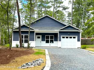 321 NE 52nd Street, Oak Island, NC 28465 – photo 1: Front Elevation