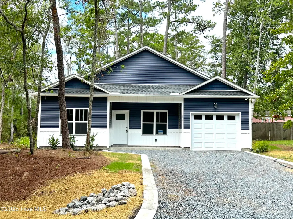 321 NE 52nd Street, Oak Island, NC 28465 – photo 1 of 58: Front Elevation