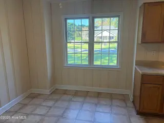 303 Dallas Avenue, Lake Waccamaw, NC 28450 — 3-bedroom home, Lake Waccamaw, NC, photo 6 of 40: Dining room