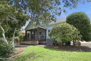 109 Oakleaf Drive, Pine Knoll Shores, NC 28512 – photo 2: Back screened porch