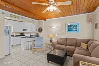 103 24th Street, Emerald Isle, NC 28594 — 4-bedroom townhome in Emerald Isle By The Sea, Emerald Isle, NC, photo 24 of 51: Kitchen & Living Area