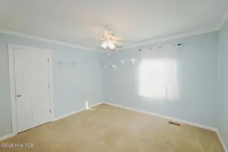 802 E Oak Island Drive, Oak Island, NC 28465 – photo 18: Bedroom 1-021-026-1500x1000