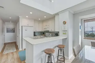2111 W Fort Macon Road 313 Dunescape, Atlantic Beach, NC 28512 – photo 4: Kitchen with bar seating