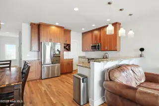 1106 Fort Fisher Boulevard N Unit 1, Kure Beach, NC 28449 – photo 16: 14 - Kitchen, Dining, Living Area