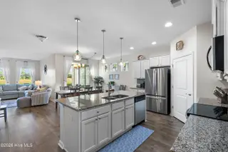 580 Slippery Rock Way, Calabash, NC 28467 — 3-bedroom home in The Farm, Calabash, NC, photo 8 of 46: Kitchen into Living