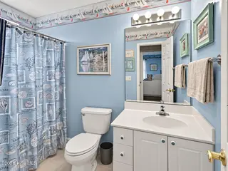 121 NE 6th Street, Oak Island, NC 28465 – photo 15: Bath