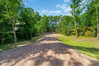 117 White Ash Drive, Pine Knoll Shores, NC 28512 – photo 11: Entrance to lot on Ash Dr