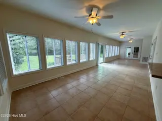103 Castelnau Court, Jacksonville, NC 28540 — 5-bedroom home in Williamsburg Plantation, Jacksonville, NC, photo 15 of 52: 8. Sunroom A