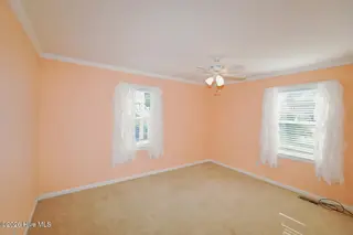 802 E Oak Island Drive, Oak Island, NC 28465 – photo 23: Bedroom 2-023-009-1500x1000