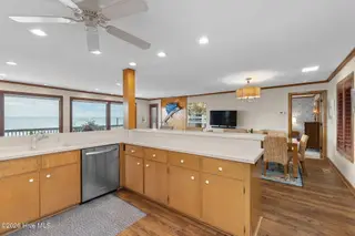 111 Dogwood Circle, Pine Knoll Shores, NC 28512 – photo 17: Open concept kitchen to dining room