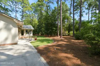 55 Birdie Drive, Whispering Pines, NC 28327 – photo 8: backyard side view
