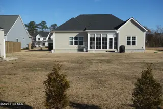 6829 Campbells Ridge Drive SE, Leland, NC 28451 – photo 24: Rear of House from Property Line_5603