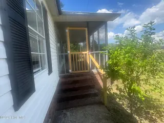 1461 Core Point Road, Blounts Creek, NC 27814 – photo 3: New front porch door handrail