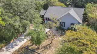 224 NE 51st Street, Oak Island, NC 28465 – photo 2: 56-Final Drone 224 NE 51st St OKI-RJREM-