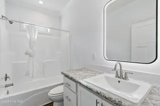 9163 Southern Boulevard SE, Winnabow, NC 28479 — 3-bedroom home, Winnabow, NC, photo 23 of 28: Guest bathroom
