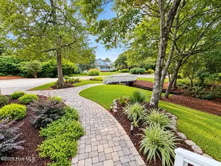 301 Wisteria Way, Caswell Beach, NC 28465 – photo 3: Front Yard