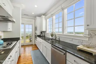 125 Roosevelt Drive, Pine Knoll Shores, NC 28512 — 5-bedroom home in Roosevelt Beach, Pine Knoll Shores, NC, photo 18 of 61: Modern kitchen w/ great views