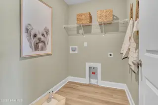 7111 Woodline Drive SW, Sunset Beach, NC 28468 – photo 24: Seaside Palms_Model_Venture_6911 Seaside