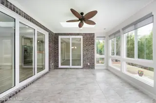 8983 Mango Bay Court NE, Leland, NC 28451 — 4-bedroom townhome in Compass Pointe, Leland, NC, photo 20 of 53: Sunroom