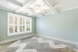 1454 Dunes Boulevard SW, Ocean Isle Beach, NC 28469 – photo 16: Main level primary suite