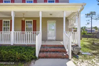 141 Crystal Road, Southport, NC 28461 — 3-bedroom home, Southport, NC, photo 2 of 40: 141 Crystal Rd front porch