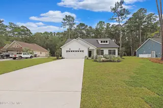 82 Northeast Drive NW, Calabash, NC 28467 – photo 23: 82 NE Front view with other homes