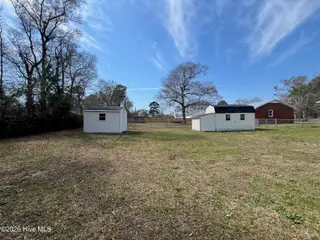 410 Loma Linda Drive, Cape Carteret, NC 28584 – photo 8: Storage buildings in back yard