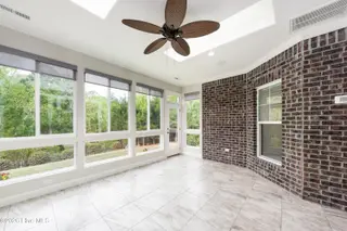 8983 Mango Bay Court NE, Leland, NC 28451 — 4-bedroom townhome in Compass Pointe, Leland, NC, photo 21 of 53: Extended Sunroom