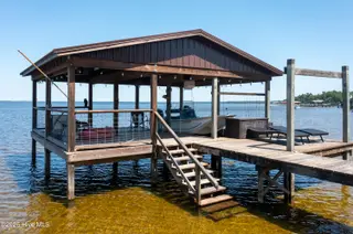 2313 Waccamaw Shores Road, Lake Waccamaw, NC 28450 – photo 16: Spacious Pier - with boat lift