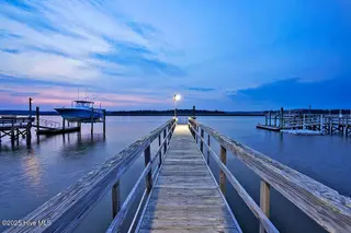 6008 W Beach Drive, Oak Island, NC 28465 – photo 13: 6008WestBeachDrive_twilight-6