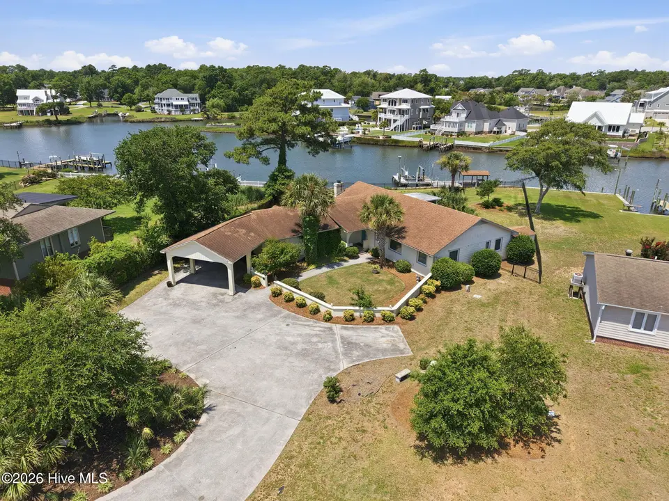 220 Club Point Drive, Cape Carteret, NC 28584 – photo 1 of 59: 15-web-or-mls-DJI_20260626121513_0324_D