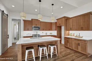399 Summerhouse Drive, Holly Ridge, NC 28445 – photo 6: Look at the abundance of cabinets!