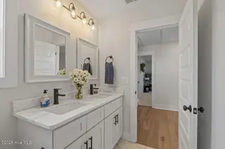 217 Coastline Circle, Cedar Point, NC 28584 – photo 23: Full bath with dual sinks